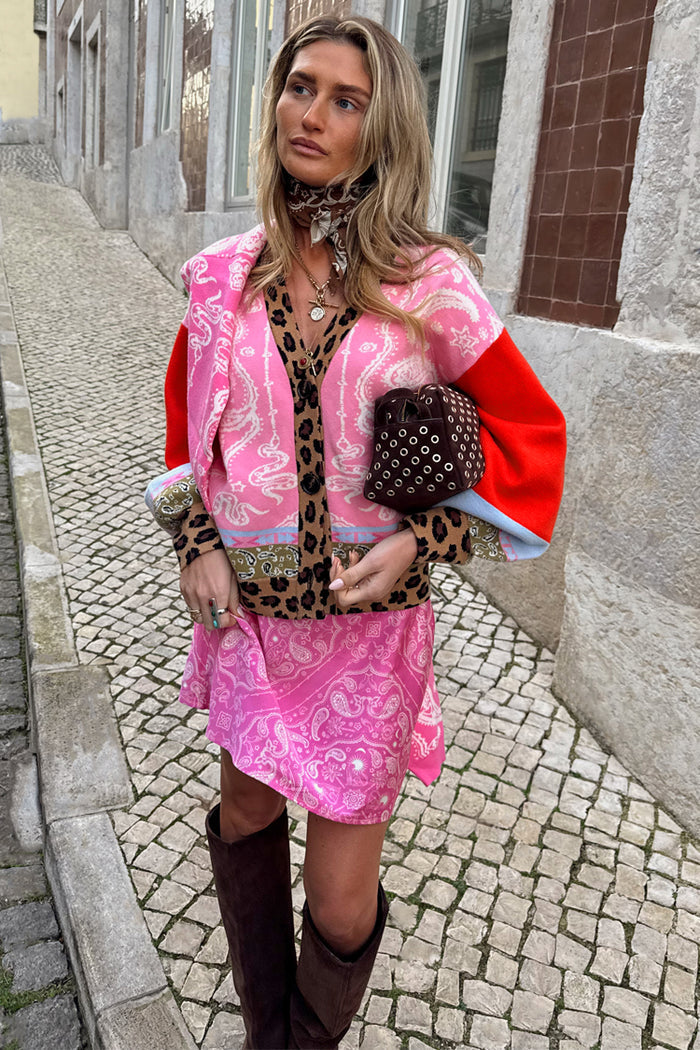 Splice Bandana Cardigan in pink paisley and leopard print, styled with a matching mini skirt and brown knee-high boots.