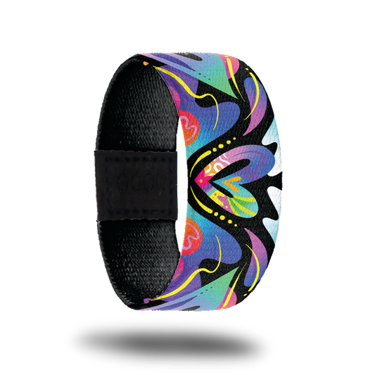 Outside design for Spread Love. Colorful blend of colors with different shapes and a heart shape in the center of the design