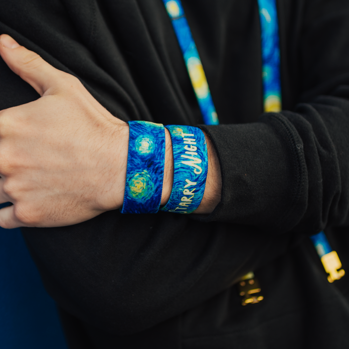 Lifestyle close up image of model's wrist wearing 2 Starry Night straps