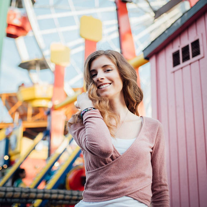 Lifestyle image of someone smiling wearing Stronger With Every Struggle