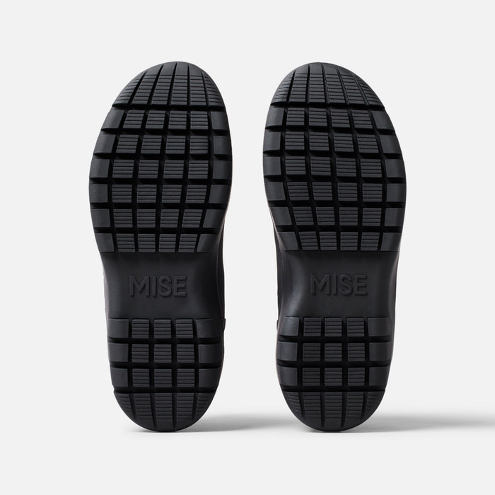 MISE Chelsea boot black slip-resistant kitchen shoes outsole view on light gray background