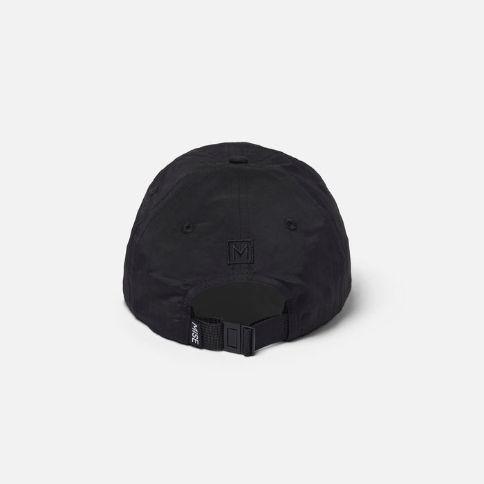 The Dad Cap gallery position 1 showing black 6-panel cap rear with adjustable strap and MISE branded tab detail