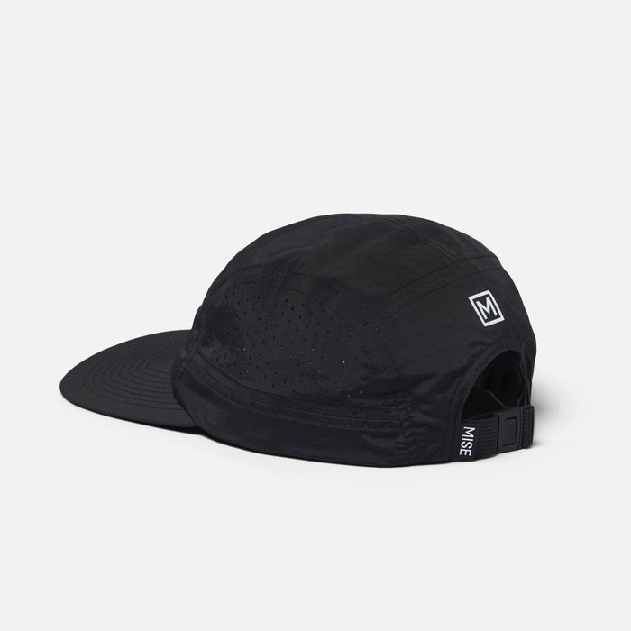 The Run Hat gallery position 1 showing black 5-panel moisture-wicking cap with adjustable back strap and MISE logo side view