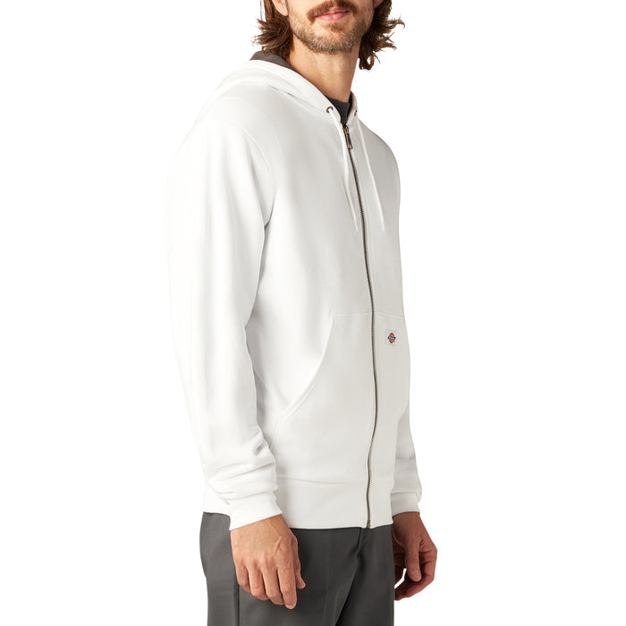Man wearing cream-colored fleece zip hoodie with kangaroo pocket and ribbed cuffs.