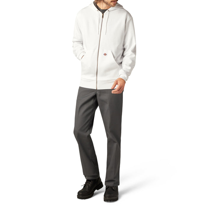Cream zip hoodie with drawstring hood and front pockets, styled with charcoal pants and black boots.