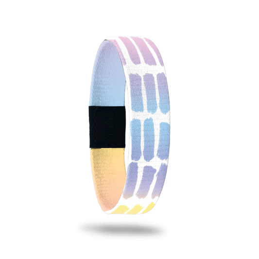 Outside Design of Think Happy Thoughts: white background with geometric pattern of painted watercolor patches that are a gradient of orange, yellow, pink, purple, and blue