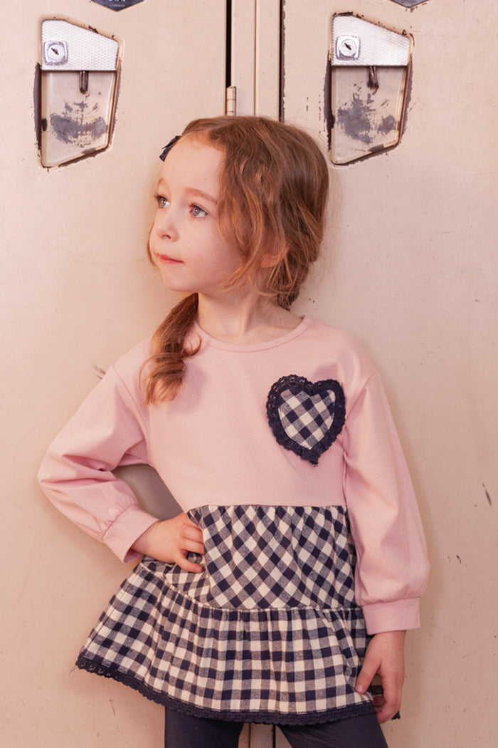 Child in the pale dusty pink and navy tunic set by Deux par Deux, second view