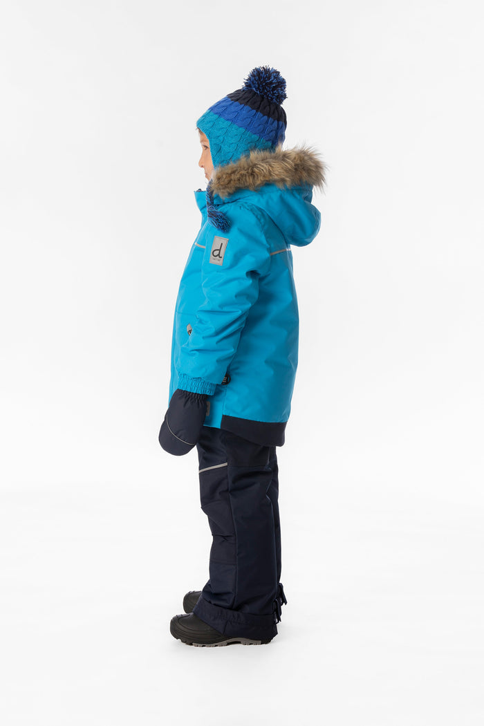 Child wearing the bright blue and navy Deux par Deux DISCOVER snowsuit, side view