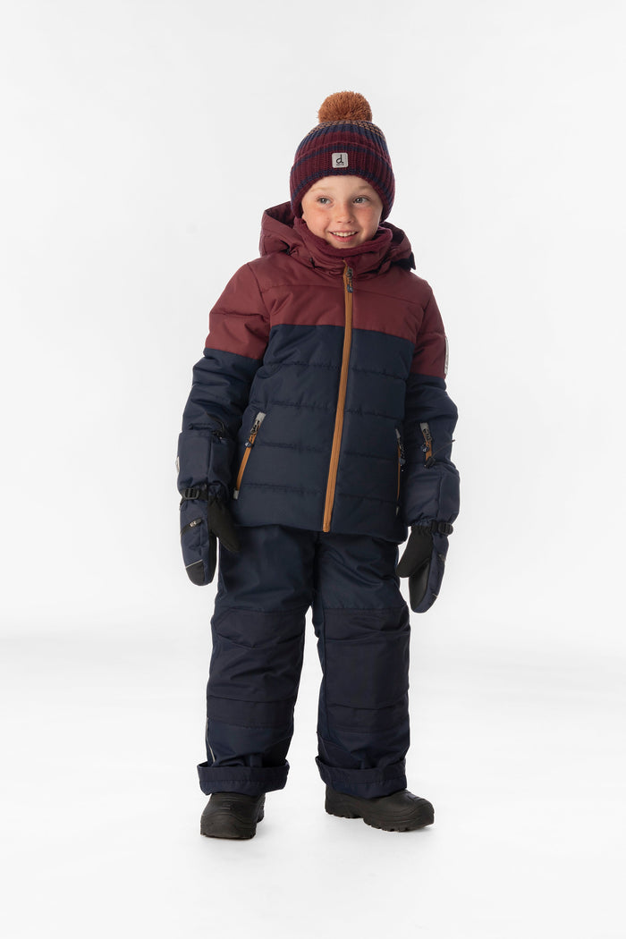 Child wearing the navy and burgundy Deux par Deux PLAY snowsuit, full-length front view
