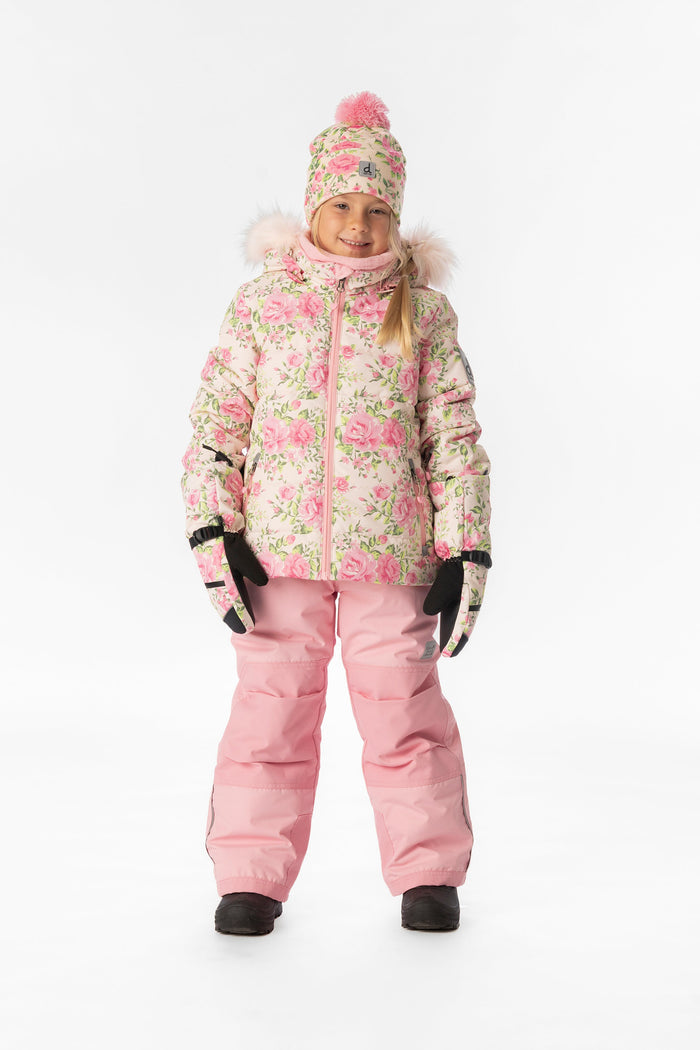 Child wearing the Deux par Deux PLAY snowsuit with pink mini flower jacket and pink snow pants, front view