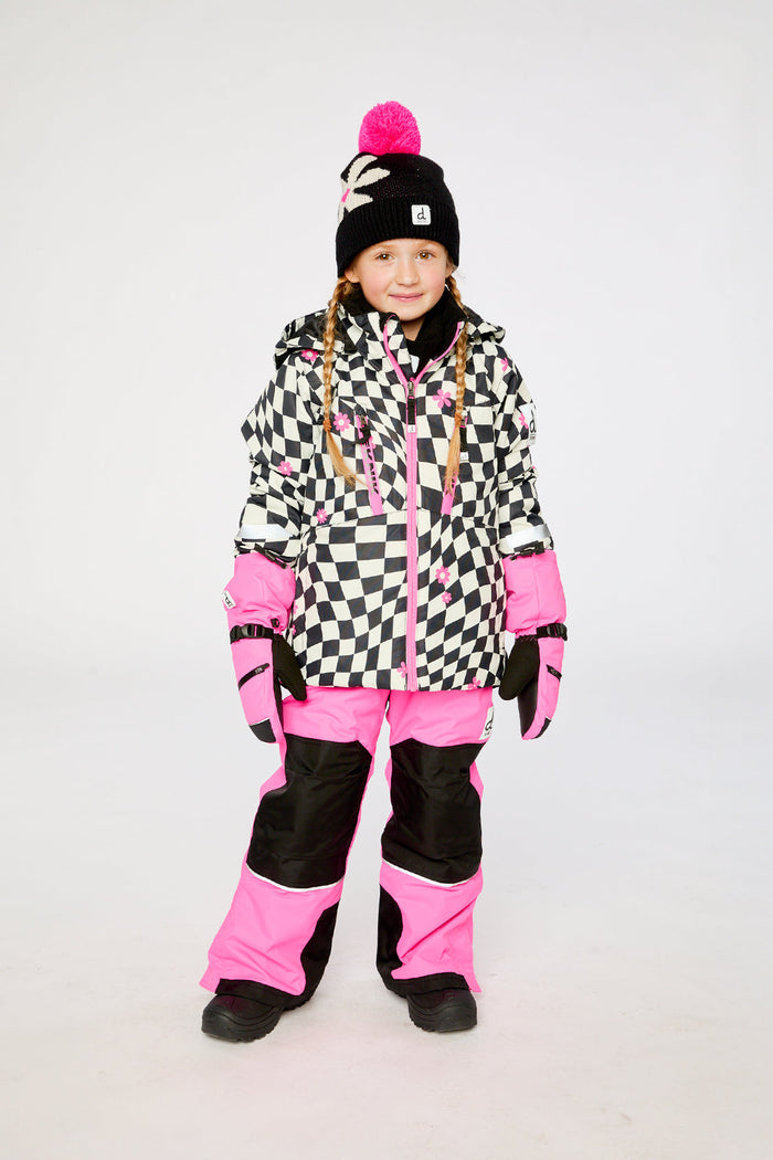 Child wearing the checkered and bright pink TEKNIK snowsuit, front view