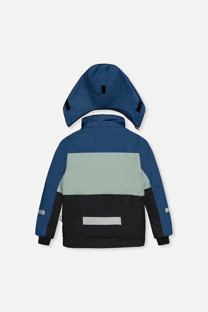 Back of the navy, pale green and black TEKNIK jacket with reflective band