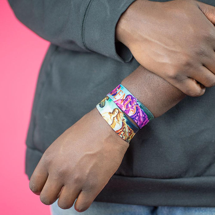 Studio image close up of 2 Venus on model's wrist
