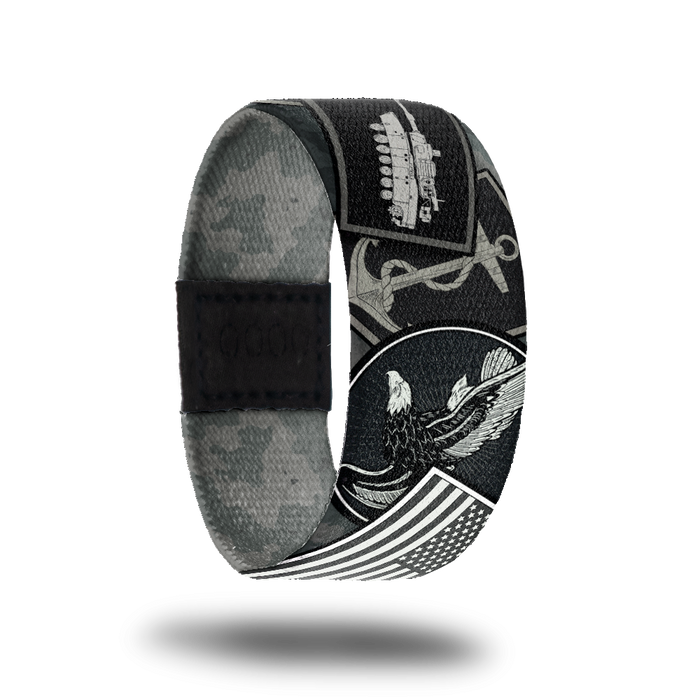product photo of the outside design of a wristband made for Veterans, the design features various symbols used for branches of the military