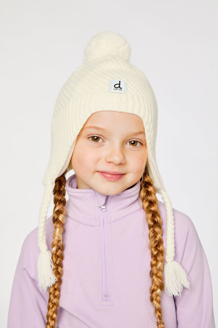 Child wearing the off-white Peruvian knit hat, view 2