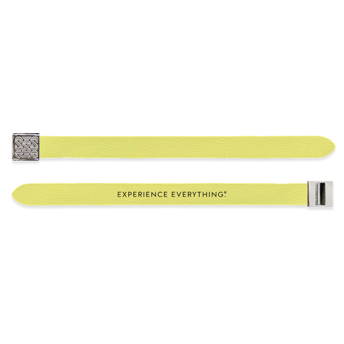 Outside Design of the V2 Imperial Yellow Solid: vegan leather material with printed on yellow background and silver buckle clasp. And Inside Design of the V2 Imperial Yellow Solid: vegan leather material with printed on yellow background with black text ‘Experience Everything’ and silver buckle clasp