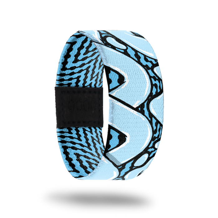 Outside design for You and Me. Blue background with black zig-zag lines and large light blue loop lines over the background