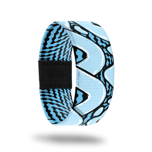 Outside design for You and Me. Blue background with black zig-zag lines and large light blue loop lines over the background