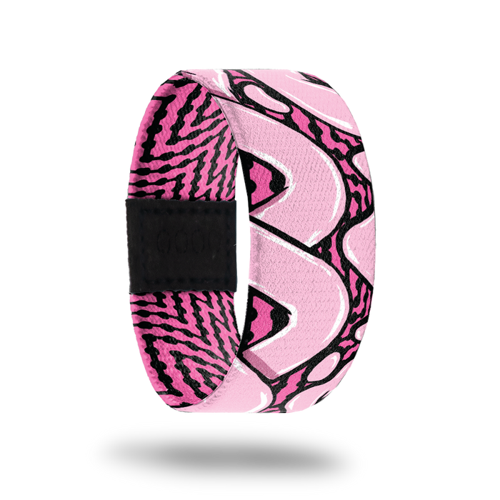 Outside design for You and Me. Dark pink background with black zig-zag lines and large light pink loop lines over the background